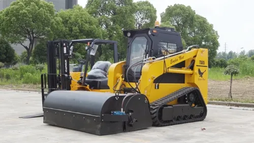 Cargadora compacta sobre orugas TS65 con accesorio